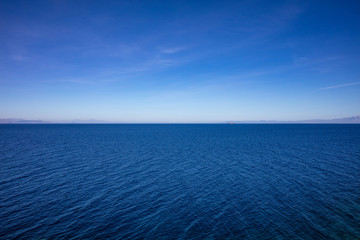 Obraz premium Greece. Aegean sea. Blue sky and calm sea water texture background