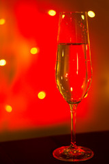 Champagne glass in disco party bar