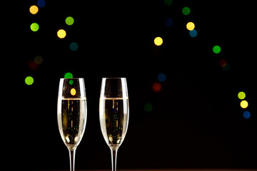 Champagne glasses on black background. Holiday celebration concept.