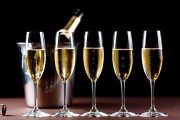 Champagne glasses on black background. Holiday celebration concept.