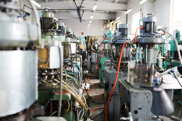 Background image of complex mechanical units in workshop of modern factory, copy space