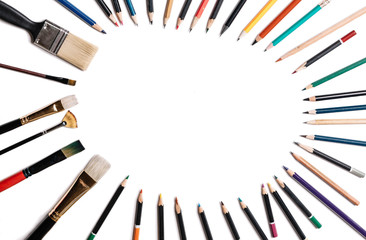 colored pencils with tassels isolated on white background. Lined in the form of an oval frame with space for text or image