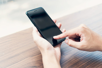 Man using smartphone, During leisure time. The concept of using the phone is essential in everyday life.