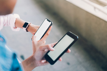 woman and man  holding a smartphone, mock up of blank screen. using cell phone on lifestyle. Technology for communication concept.