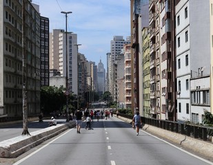 People walk around enjoying the sun and the scenery 