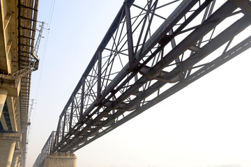 Fototapeta na wymiar An old steel frame bridge