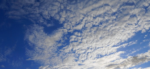 Beautiful blue sky with clouds close up.
