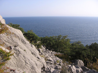 Fototapeta na wymiar mountain panoramic landscape with a high cliff on the horizon ocean sea view of the traveler in the mountains of Crimea