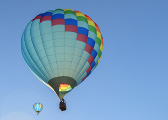 Colorful hot air balloons with blue sky in background