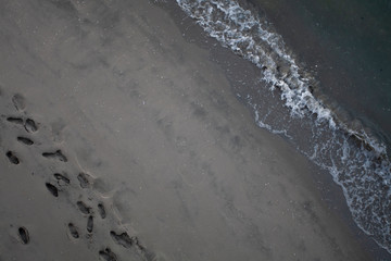 footprints and waves
