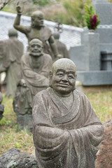 Fototapeta na wymiar Stone buddha Statue in arashiyama, Kyoto, Japan