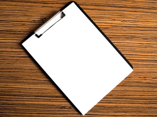 Blank white paper menu placed on a wooden table. Great for business write description or menu.