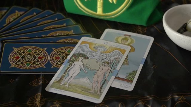 Pulling tarot card out of tree of life bag