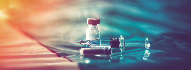 Vaccine vial dose flu shot drug needle syringe,medical concept vaccination hypodermic injection...