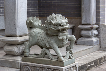 Naklejka premium lion kylin statue guarding a chinese temple