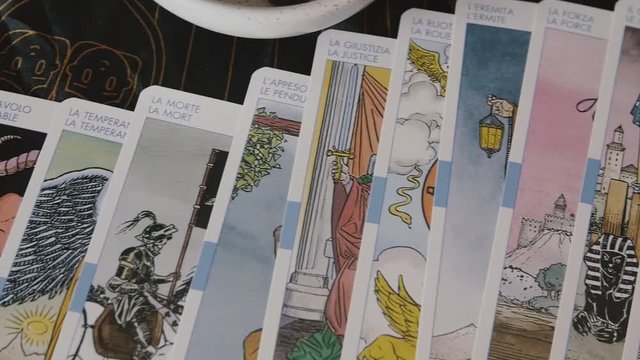Pan across Tarot cards on table