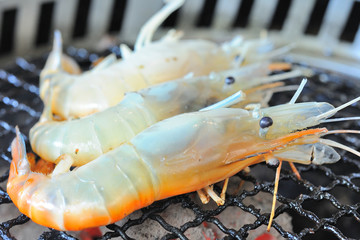 Close up shot pork grilling and bacon on grill plate. Eating Korean BBQ.
