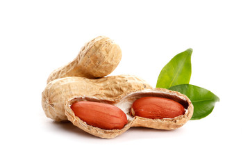 Raw peanuts on white background with green leaf. Healthy snack ona white background.Top view. close-up.