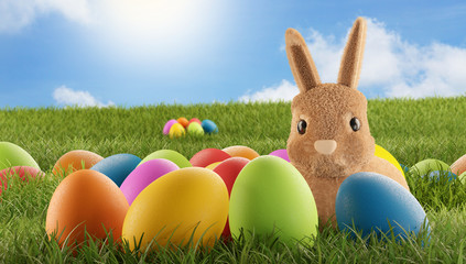 cute Easter bunny with eggs in grass 3d-illustration