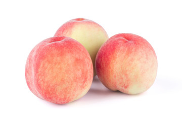 three peaches isolated on white background