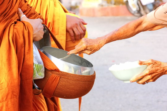 Monk Reciving Food And Many Things From Poeple. It Is South East Asia Culture....