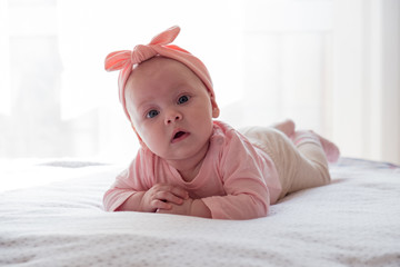 Beautiful newborn baby girl with pink headband