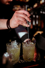 bartender prepares a  cocktail in the nightclub.