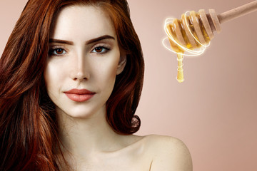 Young redhead woman and honey spoon prepare for facial mask.