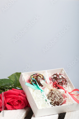 Cake Pops Are Beautifully Packed In A Gift Box Nearby Is A Bouquet