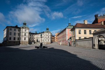 Fototapeta na wymiar An sunny spring day at the Riddarholmen island in Stockholm with old courthouses and medieval church