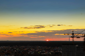 Fototapeta na wymiar Construction tower crane,Industrial construction cranes on amazing sunset sky background