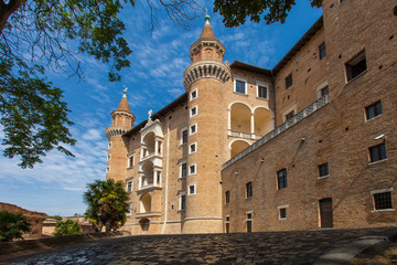 Fototapeta na wymiar The castle of the Dukes of Urbino is the former residence of the rulers of Urbino, a vivid example of the Renaissance palace complex and a monument of World Heritage.