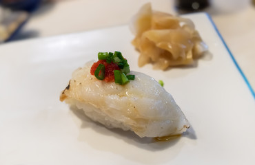 Engawa sushi or flatfish fin with rice.