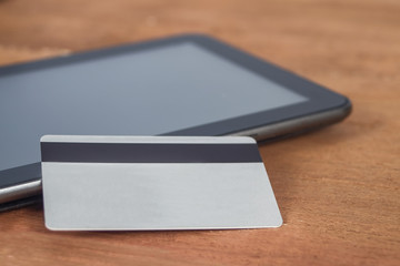 Credit card or debit card on tablet ,shopping online concept.