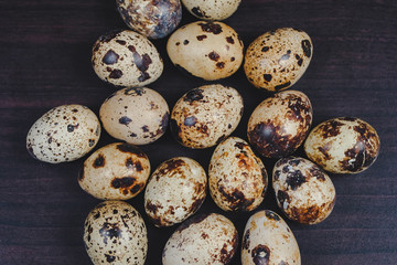 Fototapeta premium Fresh Quail eggs on background.Food and health concept.