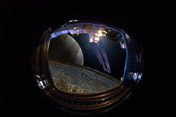 View from the window of the spacecraft on the alien worlds, Jupiter and its moon Europe. Сoncept of human space exploration. Elements of this image furnished by NASA.