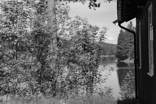 Scandinavian cabin by the lake in balck and white