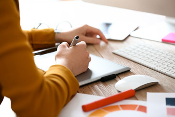 Female designer working in office, closeup