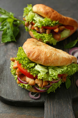 Tasty doner kebab on wooden board