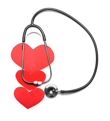 Stethoscope and red hearts on white background. Cardiology concept