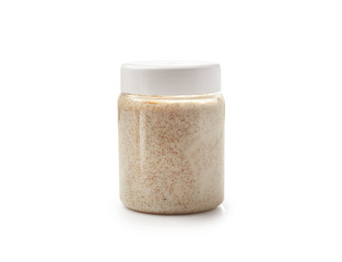 Jar of sugar scrub on white background