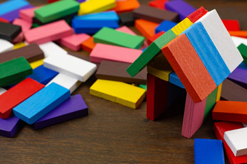 The domino multi color build home on wood table image.