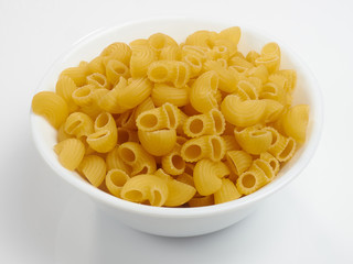 Macaroni a white bowl on a white background