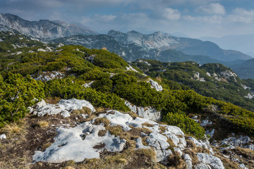 Fototapeta premium Landscape rocky mountains Styrian Alps in Austria. Some peaks of rocky hills with occasionally vegetation or sun shine.