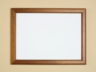 Empty frame on a beige background