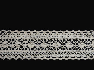 White lace on a black background