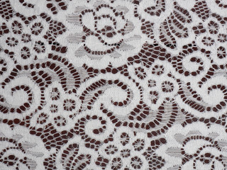 White wide lace on dark brown wooden background