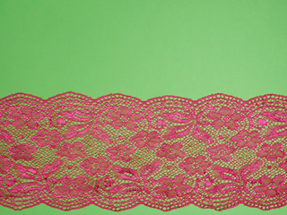 Red lace on a green background