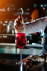 Bartender making Red Sangria in Italian restaurant.