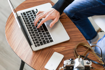 Hands on the computer keyboard , cozy working place